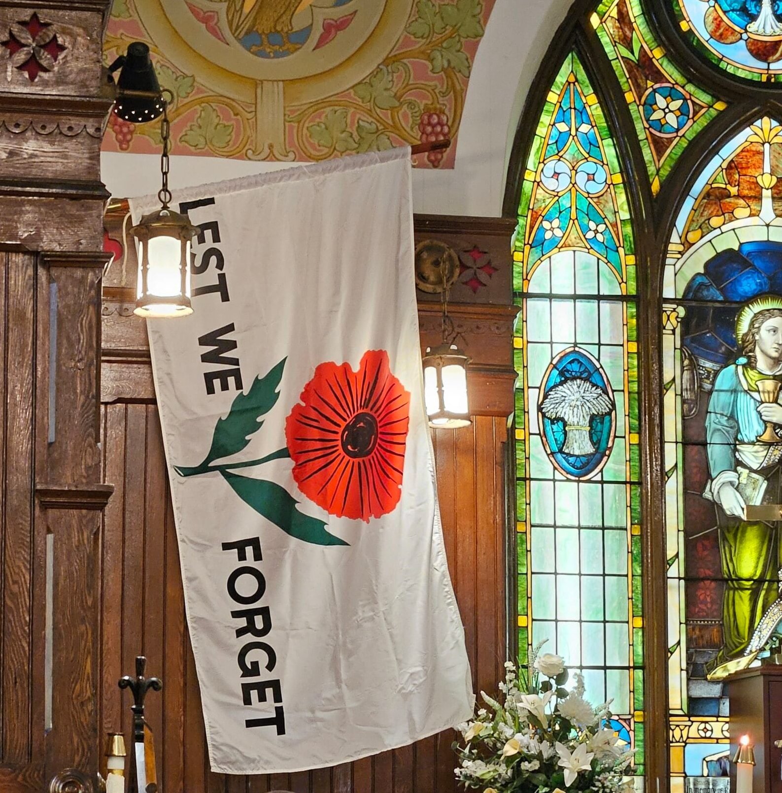 Last Post, 2 minutes of silence, Reveille white flag with words Lest We Forget